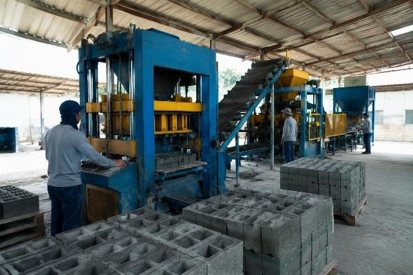 block machine Latin America production line Concrete block production line operating in a Latin American factory setting