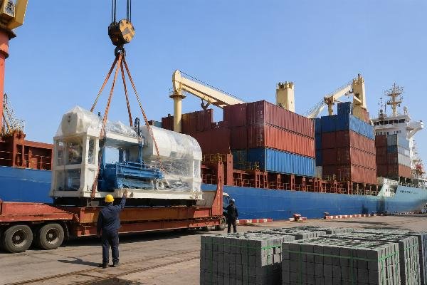 Chinese block machine manufacturer FOB shipping logistics North Africa Container ship departing Qingdao Port loaded with block machine equipment